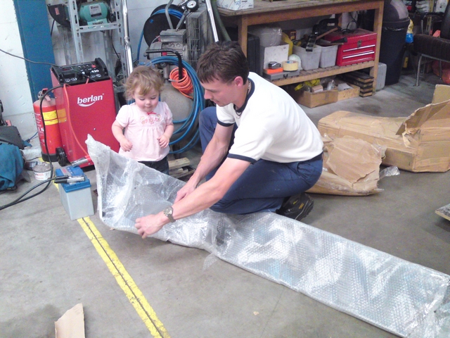 Unpacking rear bumper with daughter